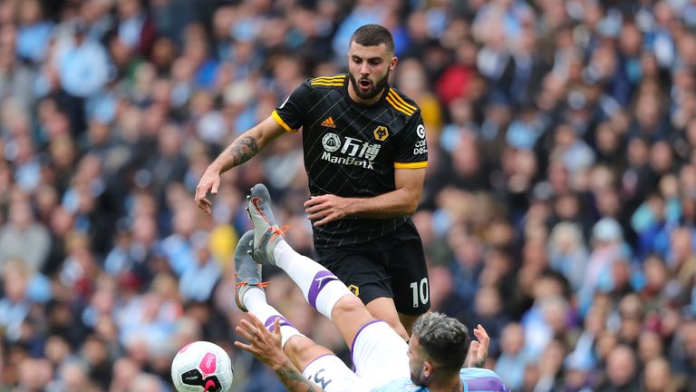 Patrick Cutrone of Wolves runs at Manchester City's Nicolas Otamendi