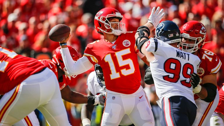 KANSAS CITY, MO - OCTOBER 13: Patrick Mahomes #15 of the Kansas City Chiefs throws a second quarter pass before the defensive pressure by J.J. Watt #99 of the Houston Texans at Arrowhead Stadium on October 13, 2019 in Kansas City, Missouri. (Photo by David Eulitt/Getty Images)