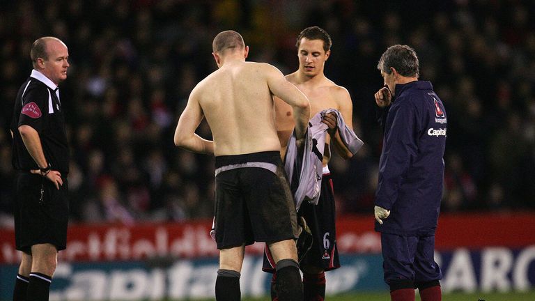 Jagielka gets Paddy Kenny's shirt after the goalkeeper's injury