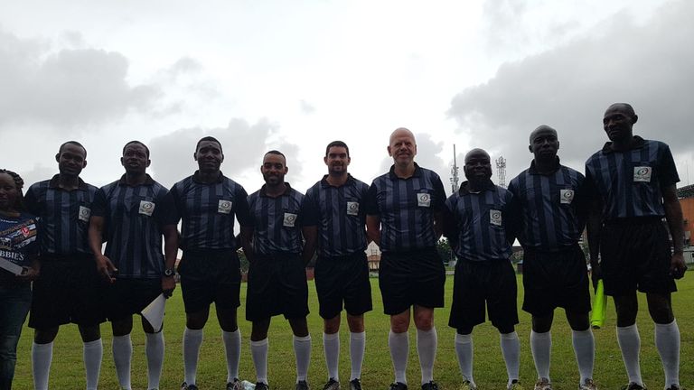 Phil Smith and Kevin de la Rose with match officials in Nigeria