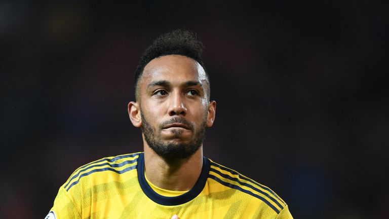 Pierre-Emerick Aubameyang acknowledges the Arsenal fans after full-time at Old Trafford