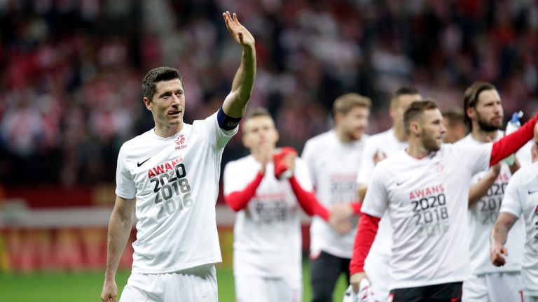 Robert Lewandowski leads the lap of honour in Warsaw as Poland reached the finals