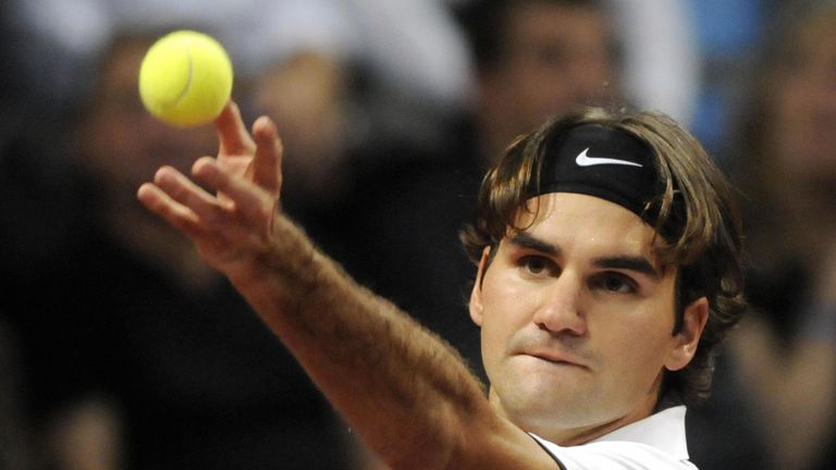 Roger Federer serves against Spanish Fernando Lopez during their semi-final match of the the Swiss Indoors tennis tournament on October 25, 2008 in Basel. Federer won 6-3, 6-2