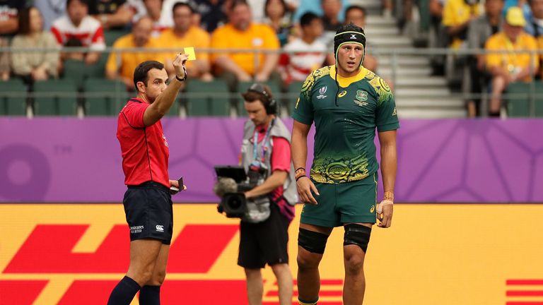 Adam Coleman is sin-binned by referee Mathieu Raynal for a high tackle