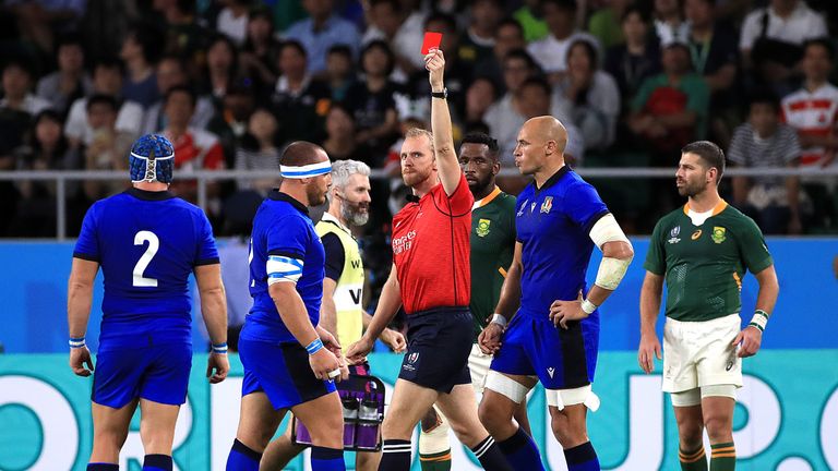 Referee Wayne Barnes gives a red card to Italy's Andrea Lovotti (left) 