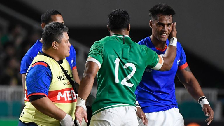 Bundee Aki with Samoa fly-half UJ Seuteni