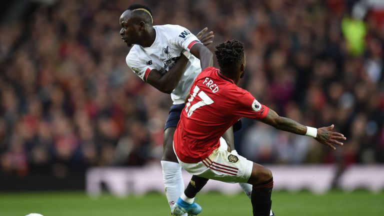 Fred and Sadio Mane compete for the ball during the game between Manchester United and Liverpool at Old Trafford in October 2019