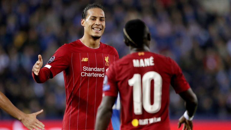 Sadio Mane celebrates with Virgil van Dijk after scoring against Genk