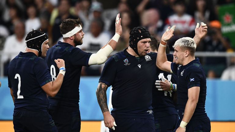 Scotland&#39;s players celebrate after scoring a try during the Japan 2019 Rugby World Cup Pool A match between Scotland and Russia at the Shizuoka Stadium Ecopa in Shizuoka on October 9, 2019. (