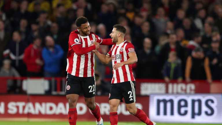 SHEFFIELD, ENGLAND - OCTOBER 21: Lys Mousset of Sheffield United celebrates after scoring a goal to make it 1-0 with George Baldock during the Premier League match between Sheffield United and Arsenal FC at Bramall Lane on October 21, 2019 in Sheffield, United Kingdom. (Photo by James Williamson - AMA/Getty Images)