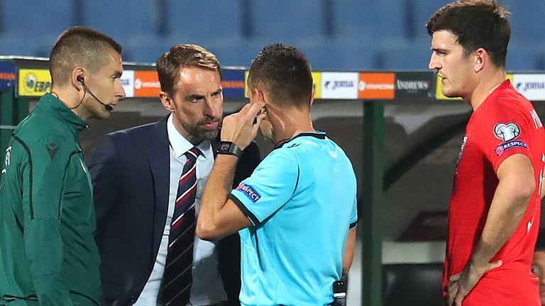 Gareth Southgate speaks to the referee after racist chants were heard during Bulgaria vs England