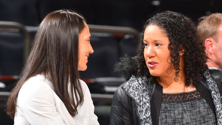 Sue Bird  and Kara Lawson chat courtside at Madison Square Garden