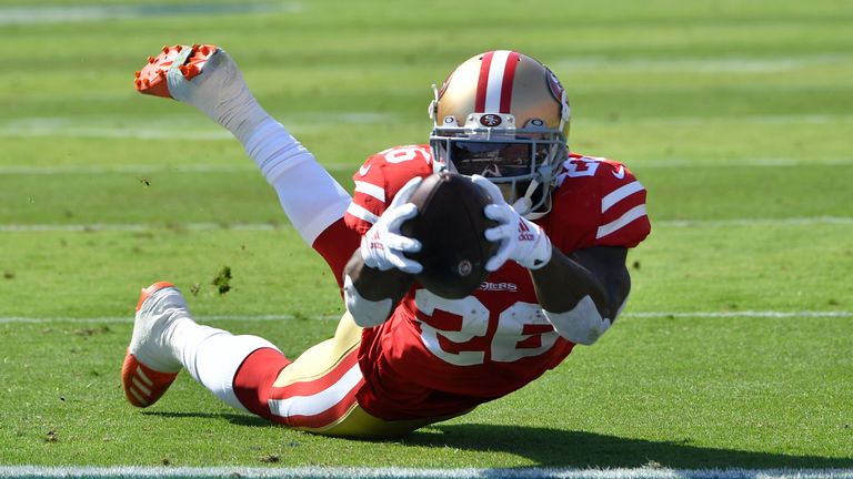 LOS ANGELES, CA - OCTOBER 13: Tevin Coleman #26 dives into the endzone to score a touchdown agtainst the Los Angeles Rams in the first quarter at Los Angeles Memorial Coliseum on October 13, 2019 in Los Angeles, California. (Photo by John McCoy/Getty Images)