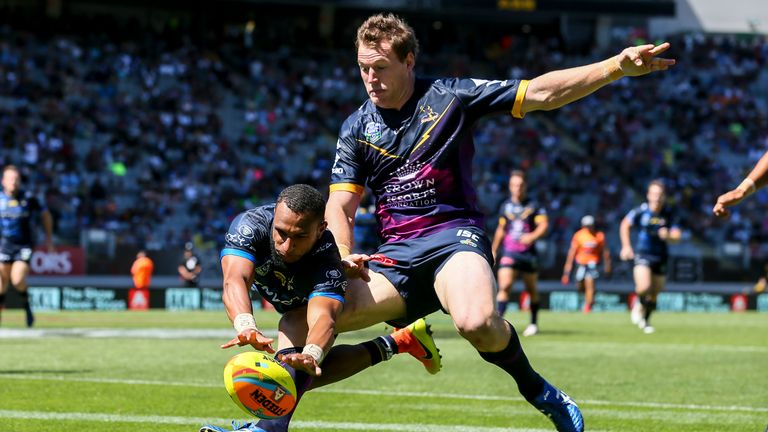 AUCKLAND, NEW ZEALAND - FEBRUARY 05: Gideon Gela-Mosby of the Cowboys scores a try in the tackle of Tim Glasby of the Storm during the 2017 Auckland Nines quarter final match between the North Queensland Cowboys and the Manly Sea Eagles at Eden Park on February 5, 2017 in Auckland, New Zealand. (Photo by Simon Watts/Getty Images)