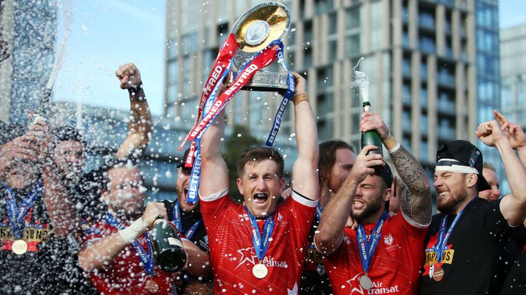 Picture by Vaughn Ridley/SWpix.com - 05/10/2019 - Rugby League - Betfred Championship Grand Final - Toronto Wolfpack v Featherstone Rovers - Lamport Stadium, Toronto, Canada - Captain Josh McCrone of the Toronto Wolfpack lifts the Betfred Championship Trophy.