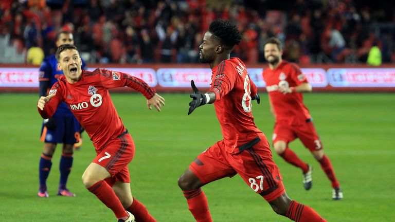Tosaint Ricketts celebrates scoring the second goal for Toronto against New York City 