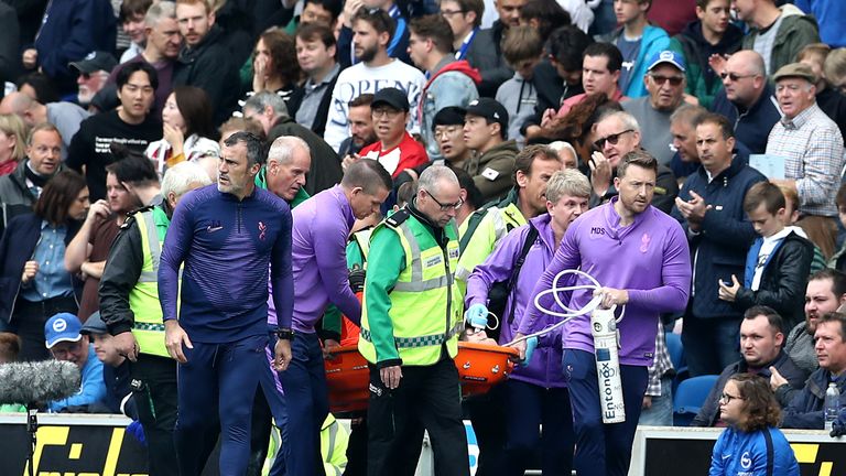 Tottenham goalkeeper Hugo Lloris is carried off against Brighton
 