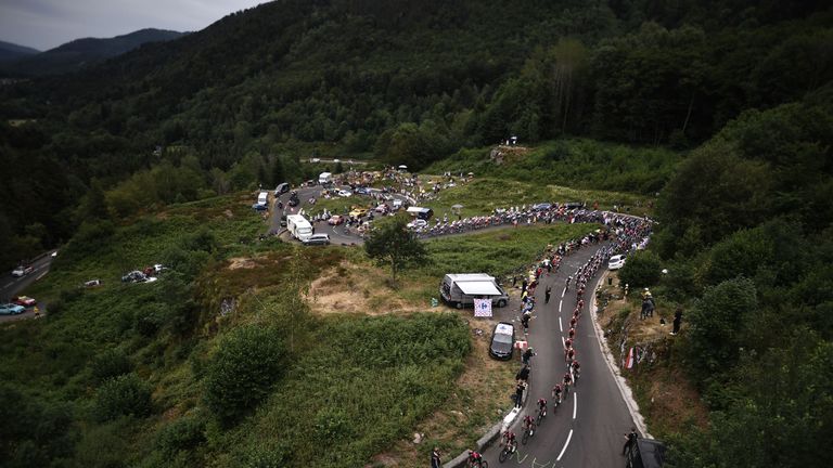 The pack rides on a panoramic road during the sixth stage of the 106th edition of the Tour de France cycling race between Mulhouse and La Planche des Belles Filles, on July 11, 2019. (Photo by Marco Bertorello / AFP) (Photo credit should read MARCO BERTORELLO/AFP/Getty Images)