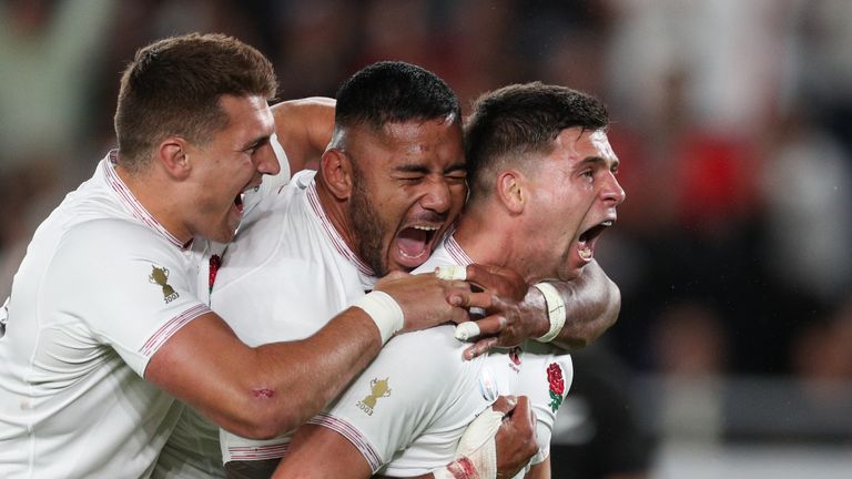 Manu Tuilagi (middle) scored England's only try as a wonderful team performance earned a Rugby World Cup final place