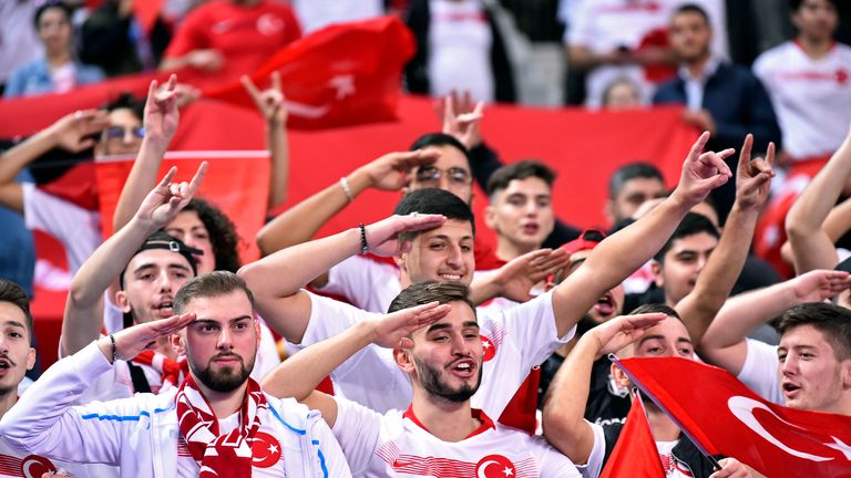 Turkey's supporters performing the political gesture during their European Qualifier against France