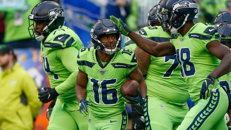 SEATTLE, WA - OCTOBER 03:  Wide receiver Tyler Lockett #16 of the Seattle Seahawks is congratulated by teammates after scoring a touchdown in the first quarter against the Los Angeles Rams at CenturyLink Field on October 3, 2019 in Seattle, Washington.  (Photo by Otto Greule Jr/Getty Images) *** Local Caption *** Tyler Lockett
