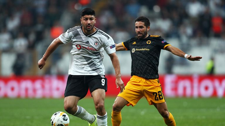 Guven Yalcın of Besiktas battles for possession with Joao Moutinho