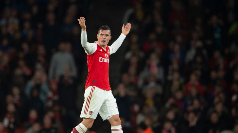 Xhaka reacts to jeers from the Arsenal supporters as he leaves the field