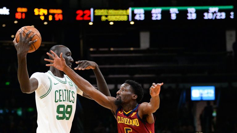 Tacko Fall shields the ball from a Cavaliers defender