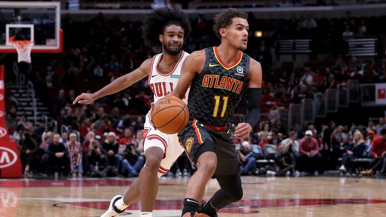 Trae Young evades the attention of Coby White