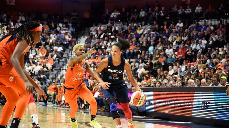 Kristi Toliver handles the ball while guarded by Courtney Williams