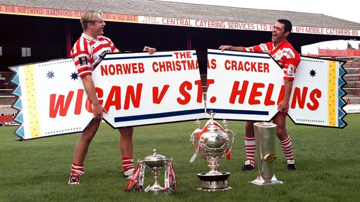 Arch rivals St Helens RLFC and Wigan RLFC who between them captured all three major Super League trophies in the inaugural 1996 campaign, are to meet head on in a special two-legged winter contest. Wigan's Central Park will stage the first game on Boxing day with the deciding match being played at St Helens' Knowsley Road ground, the series being determined by aggregate score. Rugby League's ultimate derby fixture is sponsored by Norweb in a five figure deal. Simon Houghton (left) and Saints Tom