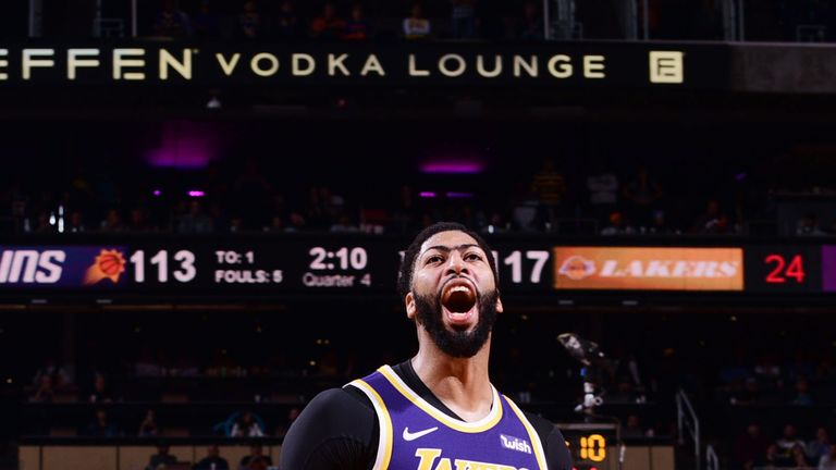 Anthony Davis celebrates a basket in the Lakers&#39; win over the Suns