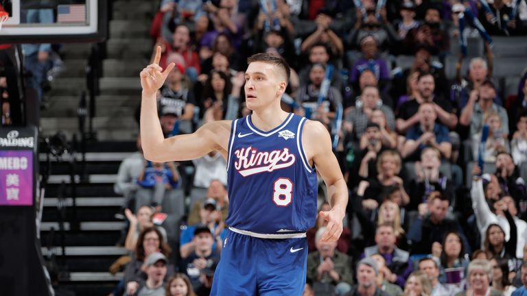 Bogdan Bogdanovic salutes the crowd after making a three-pointer
