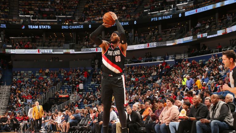 Carmelo Anthony shoots a three-pointer during his Portland debut