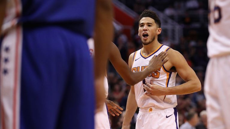 Devin Booker celebrates during the Suns&#39; victory over the 76ers