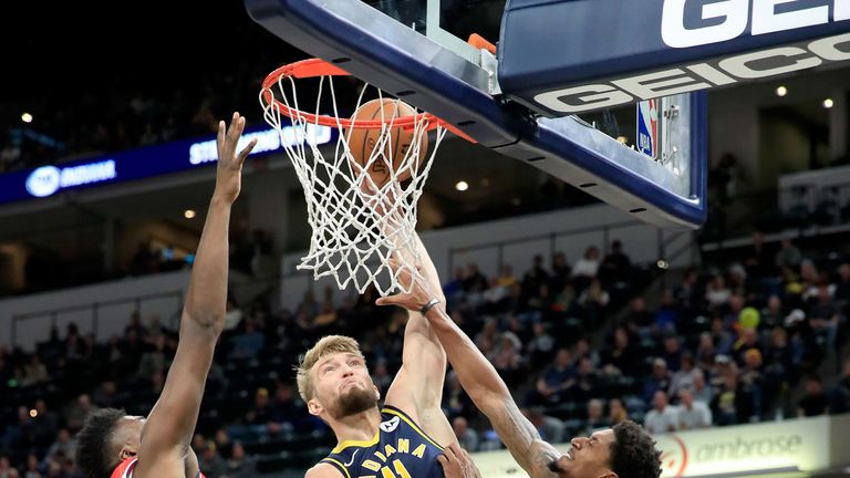 Domantas Sabonis finishes at the rim against the Wizards