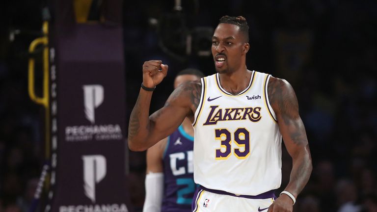 Dwight Howard celebrates a successful Lakers play against the Charlotte Hornets