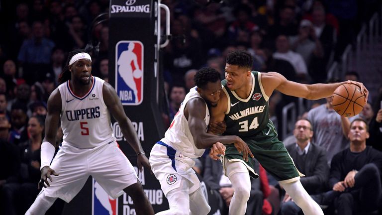 Giannis Antetokounmpo backs down Patrick Beverley