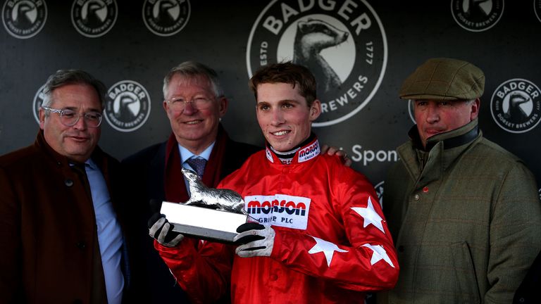 Harry Cobden poses with the trophy after winning the Badger Beers Silver Trophy Handicap Chase with Sir Alex Ferguson (second left) at Wincanton Racecourse. PA Photo. Picture date: Saturday November 9, 2019. See PA story RACING Wincanton. Photo credit should read: Steven Paston/PA Wire