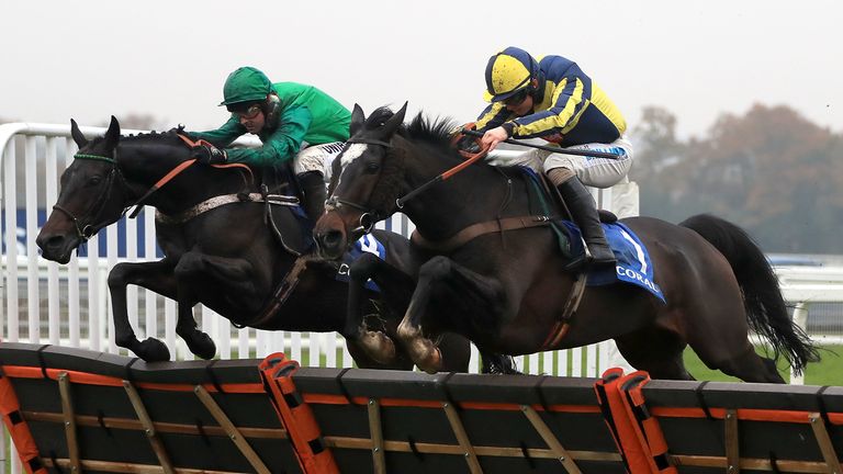 If The Cap Fits ridden by Sean Bowen (right) jumps the last to win The Coral Hurdle Race during day two of the Discover Racehorse Ownership Weekend at Ascot Racecourse. PA Photo. Picture date: Saturday November 23, 2019. See PA story RACING Ascot. Photo credit should read: Simon Cooper/PA Wire.