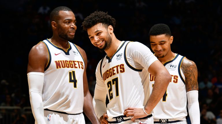 Jamal Murray shares a laugh with Nuggets team-mate Paul Millsap