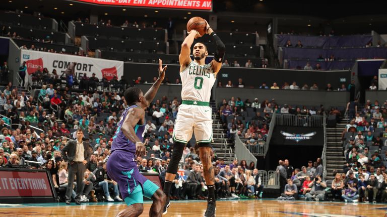 Jayson Tatum raises up for a jump shot against the Hornets