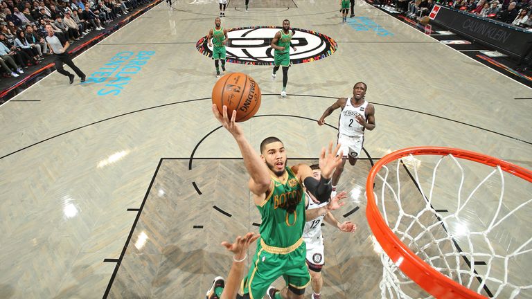 Jayson Tatum rises to the rim to score against the Brooklyn Nets
