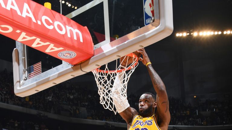 LeBron James dunks in the Lakers' win over the Thunder