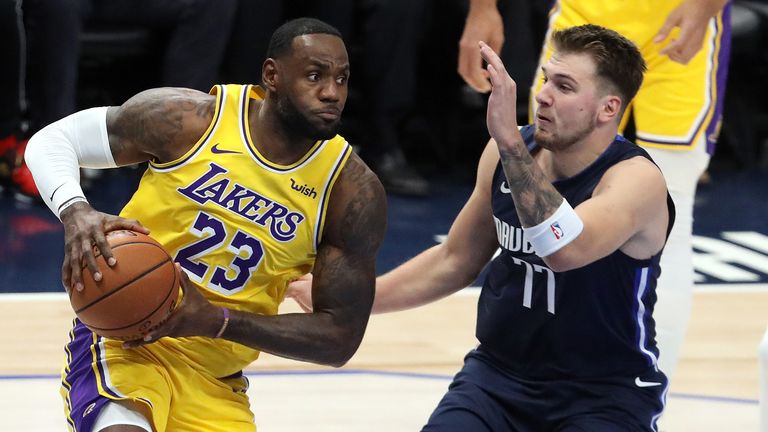 LeBron James drives against Luka Doncic