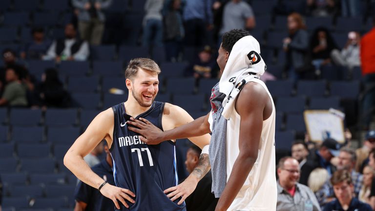 Luka Doncic is congratulated by Memphis&#39; Jaren Jackson Jr