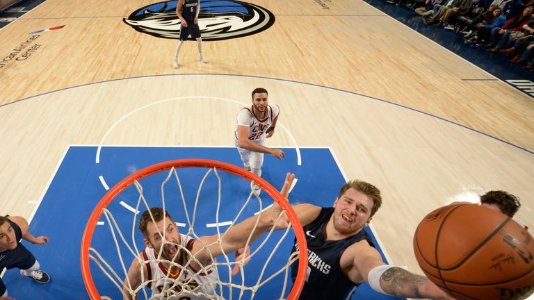 Luka Doncic finishes at the rim against the Cleveland Cavaliers
