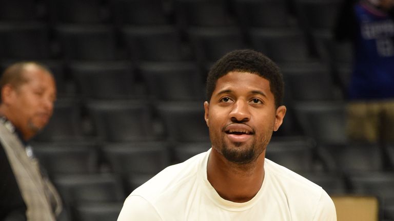 Paul George does a shooting drill prior to  a Clippers game