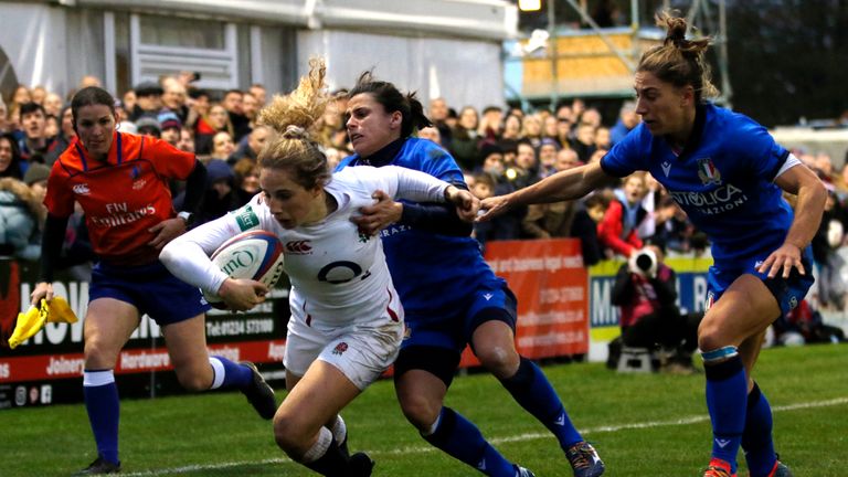 Abby Dow takes on Sara Barattin on her way to scoring a try for England