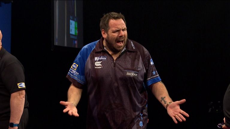 Adrian Lewis celebrates during his game against James Wade